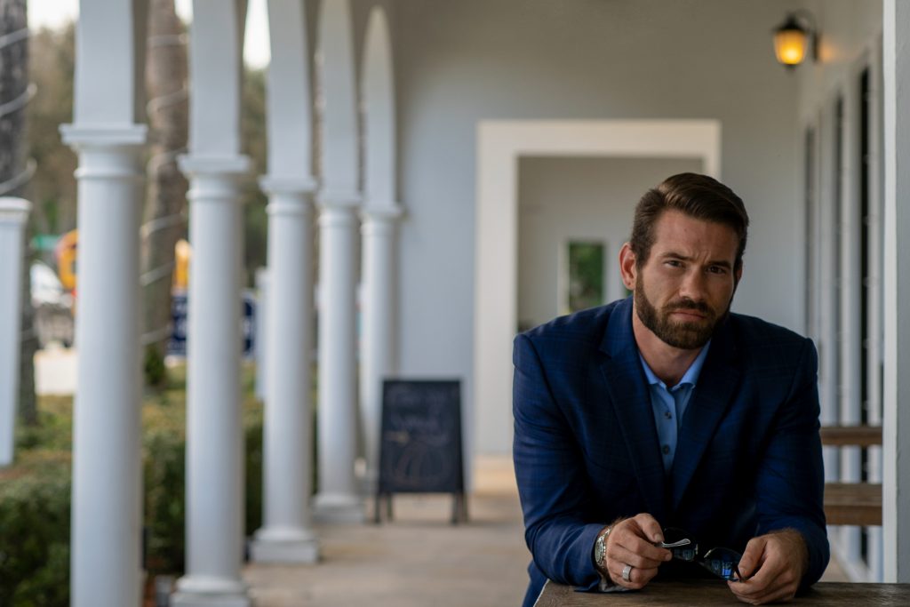 Ryan Tisko seated outdoors