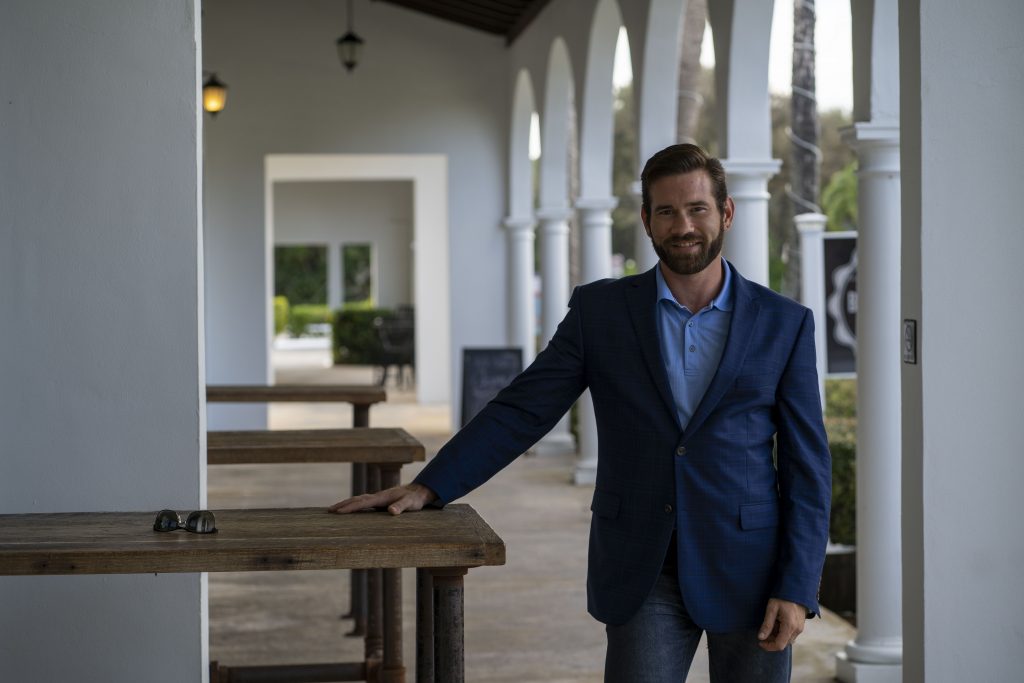 Ryan Tisko standing in a navy blazer